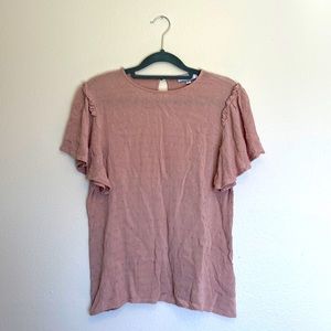 A dip of darling dusty pink Swiss dot short sleeve blouse